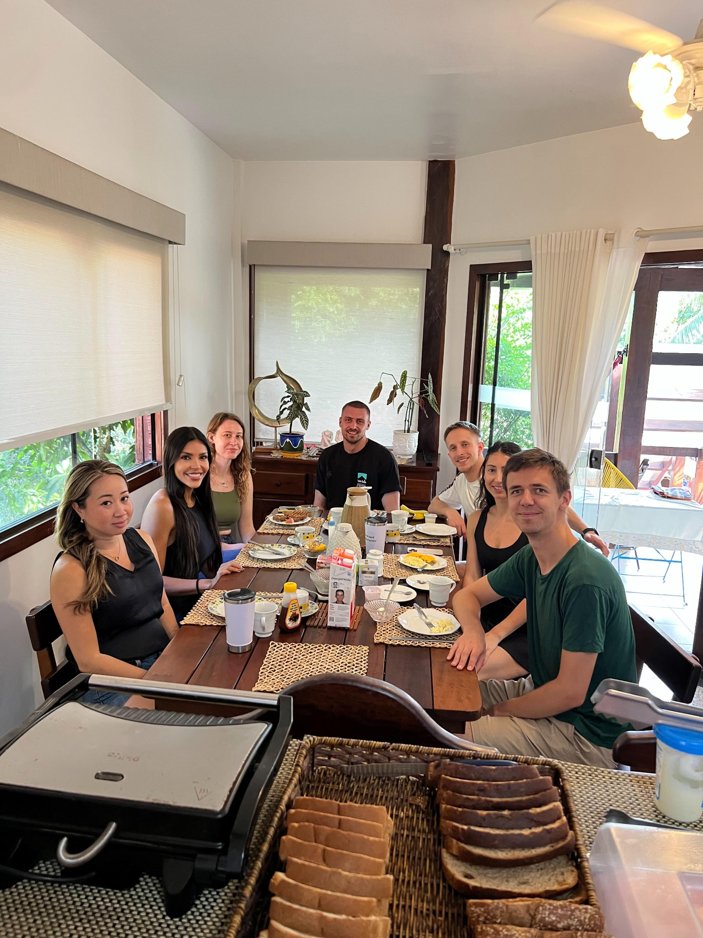 The whole group having breakfast together at the table