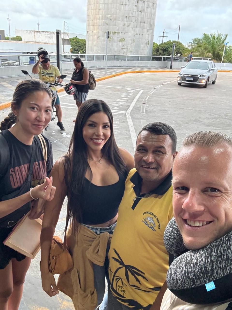 Vanessa picking up guests at the airport, selfie with the group